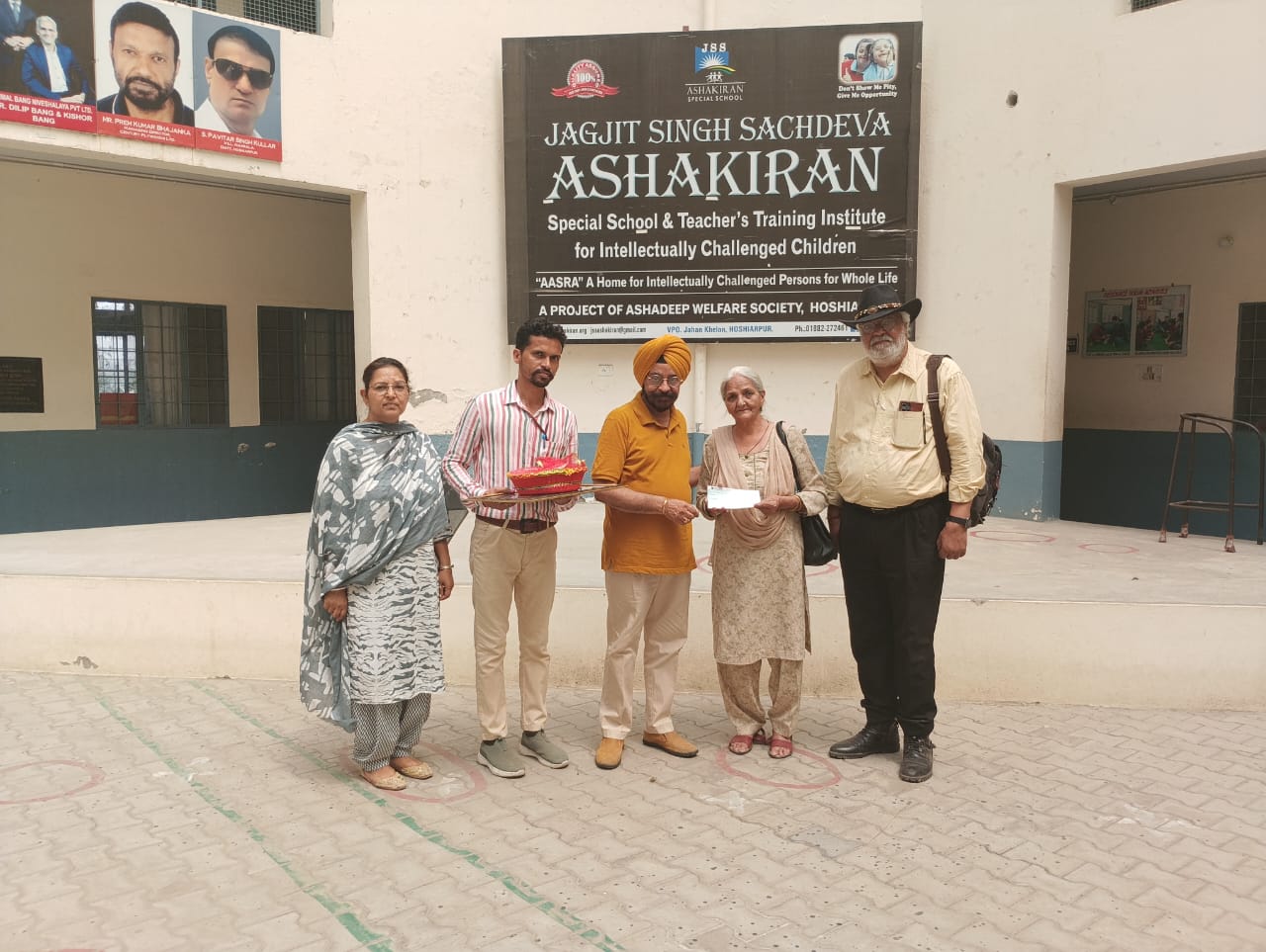 Colonel Koondel and his mother donated Rs 2 lakh to Asha Kiran School.